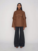 Tailored poncho with front flap pocket and double sleeves
