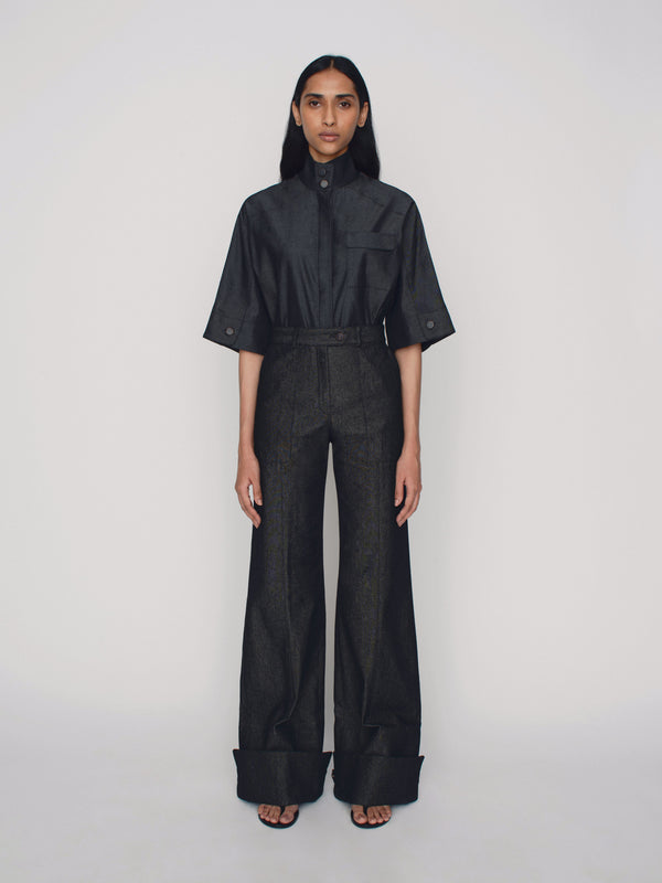 Wide leg tailored denim trousers with cuff details on the hem