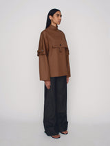 Tailored poncho with front flap pocket and double sleeves