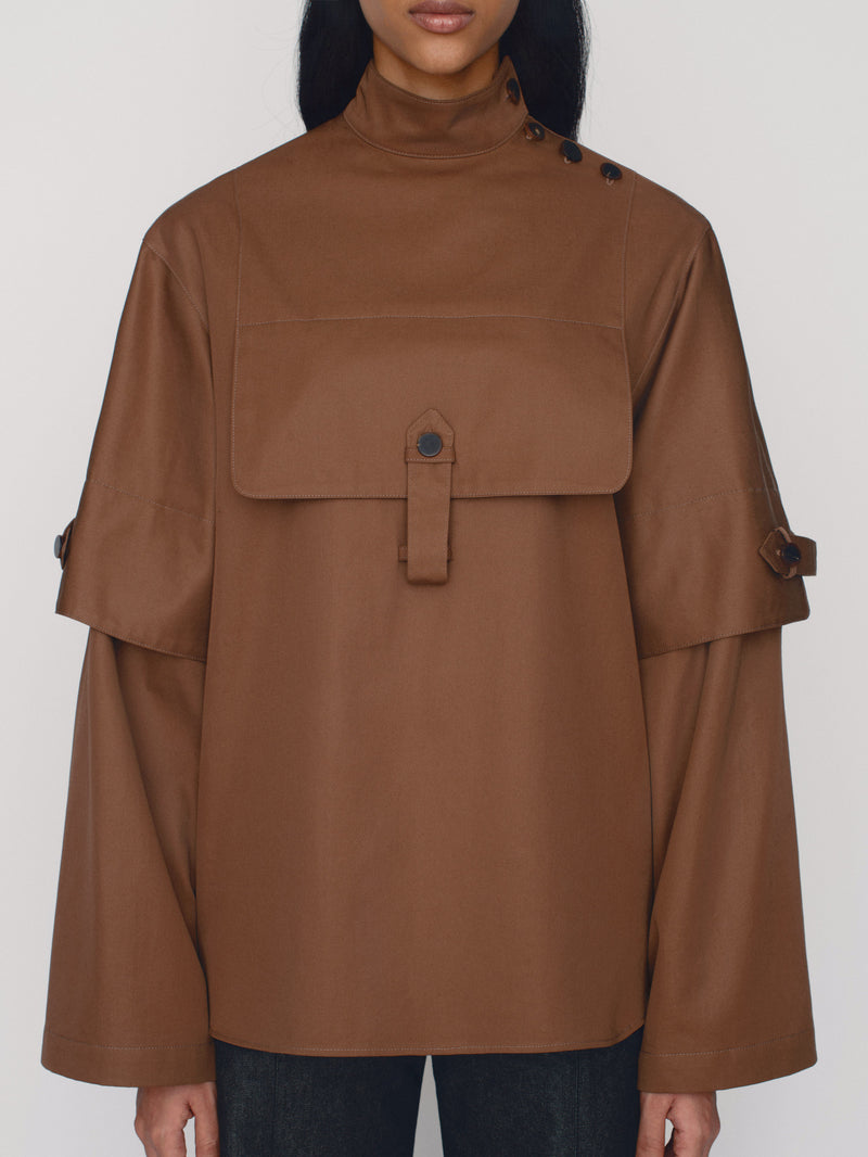 Tailored poncho with front flap pocket and double sleeves