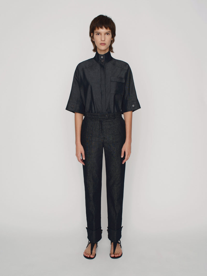 Tailored straight fit denim trousers with cuff details on the hem